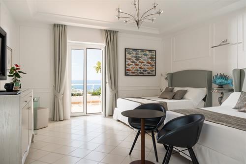 Superior con 2 letti queen e vista mare